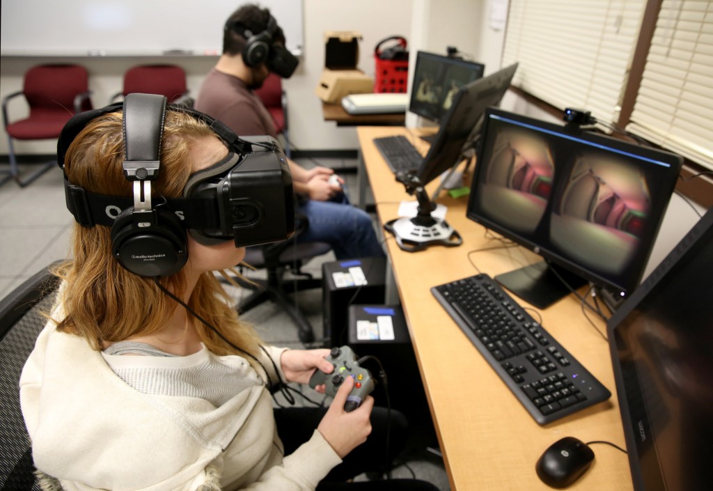 Students use the Oculus Rift in the Game Design and Development computer lab during winter term classes Wednesday, January 14, 2015. Students in the game design and development program will once again travel to L.A. to present their projects to the Jim Henson Company. This time, they are working with the Oculus Rift, a head-mounted virtual reality display.(UW-Stout photo by Brett T. Roseman)