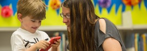 Natasha Heinlein, of Muskego, uses the 1000 Books Before Kindergarten app developed at UWM to track books read to her son, Eli.