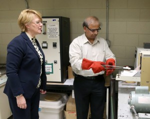 Natalia Sobczak, of Poland, and UW-Stout’s Rajiv Asthana conduct a test on wetting of an oxide ceramic by molten copper in the Ceramic and Powder Metallurgy Lab in Fryklund Hall.