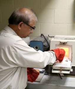 UW-Stout’s Rajiv Asthana, who does research for NASA, conducts a test in the Ceramic and Powder Metallurgy Lab at UW-Stout.