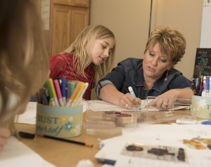 Photos of Karen Stuttgen in the classroom teaching and interacting with students at Fall Creek Elementary School