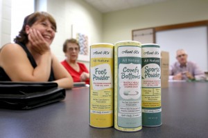 From left, Aunt K’s All Natural Remedies owners Kay Widule and Sharon Horstman discuss their product with Roger Gehring of UW-Stout’s Discovery Center.