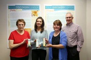 Roger Gehring, right, of UW-Stout’s Discovery Center, helped Aunt K’s of Eau Claire get its business up and running. From left are co-owner Sharon Horstman, Adrea Widule and co-owner Kay Widule. Baby Adrea’s diaper rash was the genesis of the company.