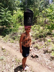 Desys Jarquin of Las Macias, Nicaragua, carries water from the village well back to the village.