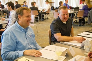 Tom Gilbertson, plant manager for International Ingredient Corp. in Whitehall, Wisconsin, left, and a partner in hiring, Tim Vondrasek, of Express Employment Professionals, meet with UW-La Crosse students to discuss labor market research students can do for the organization. 