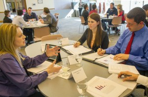 During spring semester, students in a UW-La Crosse Labor Economics course assisted community clients with labor market research. Here UWL students Shaun Fleischhacker and Marissa Eckrote, both right, meet with client, Sarah Fecht, vice president of human resources at Community Credit Union, for a round table discussion. 