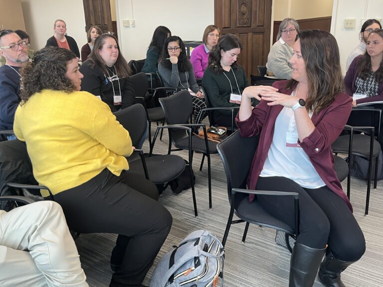 Kim Lintner of UW-Green Bay engaged in discussion with colleagues during a concurrent session at the March 2023 workshop.