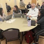 A small group discussion during a session at the UW System Navigate and Advising Workshop at UW-Stevens Point in March 2023