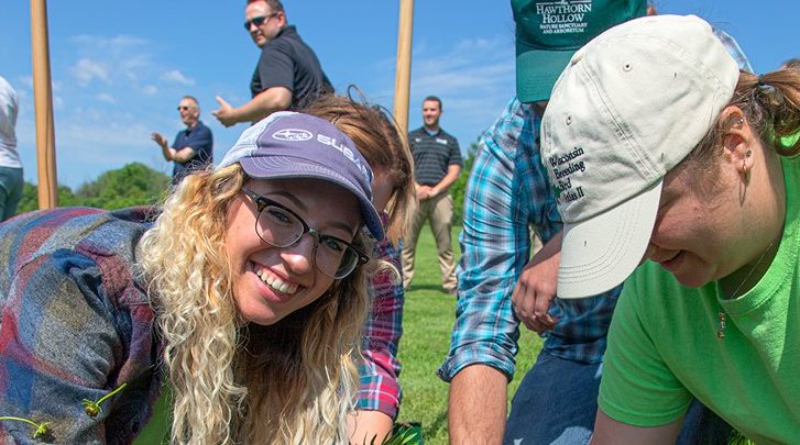 Photo of Katie Knoff helping with the Root-Pike Watershed Initiative Network to improve soil and water quality.