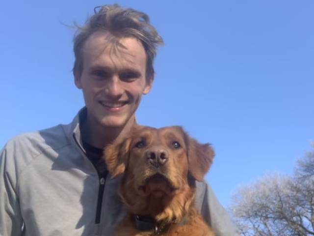 Photo of Zach Caterer, who trained his dog, Koda, as a therapy dog. They visit Eau Claire-area nursing homes once or twice a week.