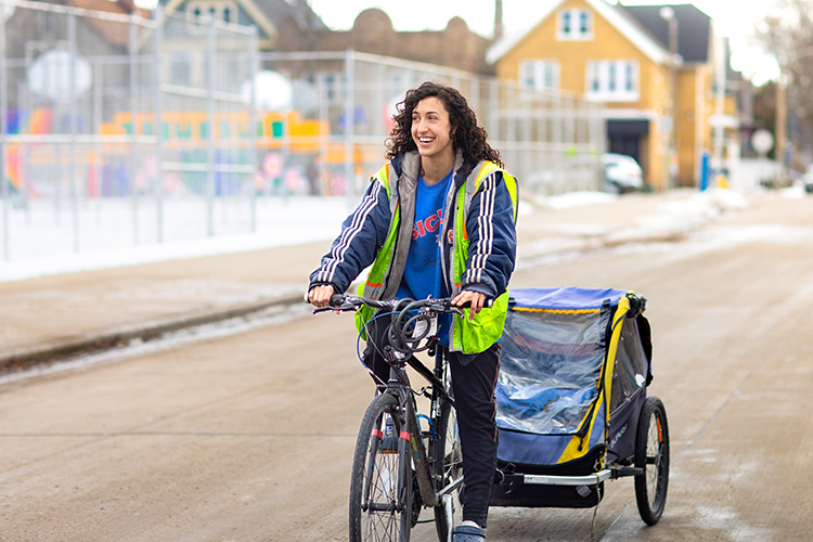 Photo of Gianni Vaccaro delivering meals in Riverwest one recent day. (UWM Photo/Elora Hennessey)