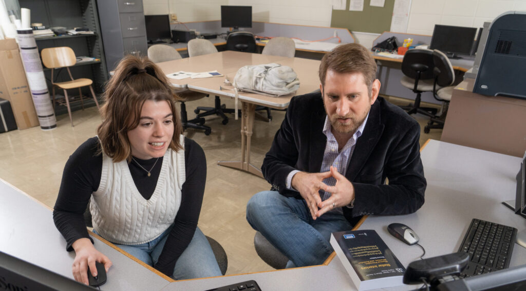 Photo of sophomore Alexis Rustin and Dr. William Wolf, assistant professor of physics and astronomy, who have been collaborating on computational astrophysics research. This summer, Rustin will be one of three Blugolds who will work with Wolf on research supported by a newly awarded National Science Foundation $526,813 CAREER grant. (Photo by Shane Opatz)