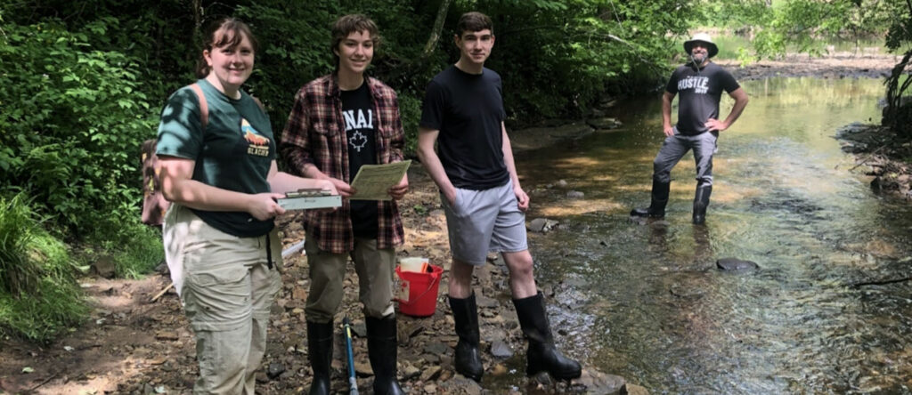 Photo of monitoring the Red Cedar Watershed, which provided valuable workforce skills to UW-Stout undergraduates.