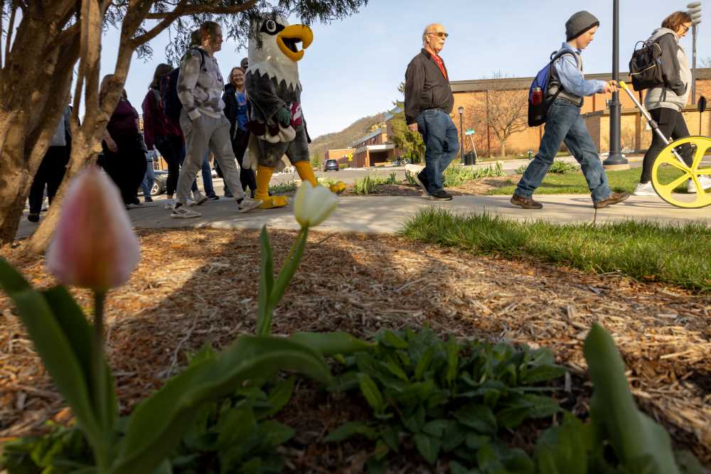 Photo of UWL Walk with an Eagle participants: Each week, students and their partners embark on a 45-minute walk around campus. Students say they enjoy the chance to connect with older adults, as well as the chance to develop practical skills in recreational therapy.