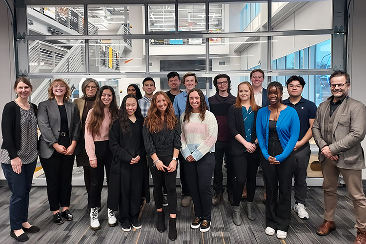 Photo of the 2022-23 cohort of the MCW Cancer Center and UWM Undergraduate Research Program included Molly Adams, Lauren Banaag, Alexia Castillo, Zechariah Cummings, Chad Darnell, Evelyn Doan, Ranjak Joshi, Rachel Kuehn, Ryan Lauer, Suha Malik, Eman Muhammad, Han Nguyen, Florin Saitis and Jenzy Walugembe. Also pictured are Kyla Esguerra (far left), UWM director of undergraduate research; Michele Battle (third from left), professor of cell biology, neurobiology and anatomy at MCW; and MCW Cancer Center director Gustavo Leone (right). (Photo courtesy of Kyla Esguerra)