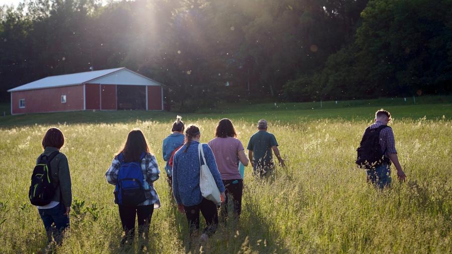 Photo of students from UW-Stout’s LAKES summer research program visiting a Dunn County Farm. / UW-Stout