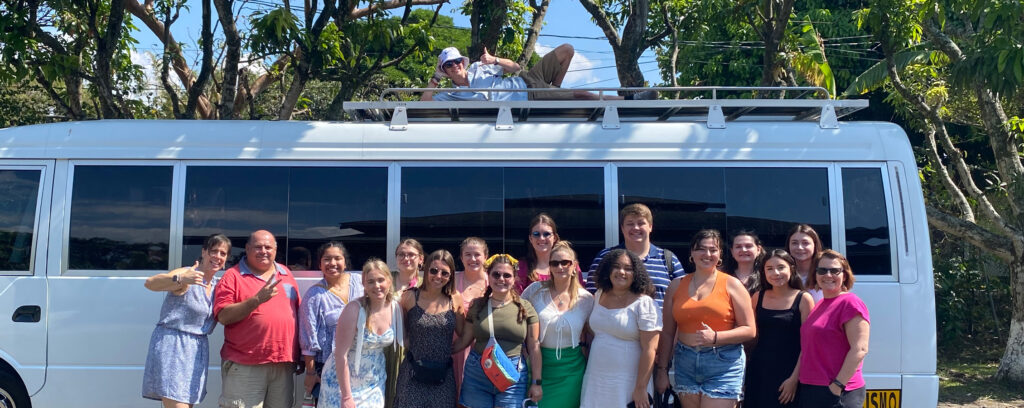 Photo of UW-Whitewater students and faculty on the road in January during a 12-day travel-study class for aspiring health care professionals in Costa Rica. (Photo courtesy Jodie Parys.)