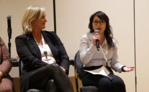 Photo of Yang speaking at the Women’s Trailblazers and Entrepreneurs Conference to speak on her entrepreneurial experience.