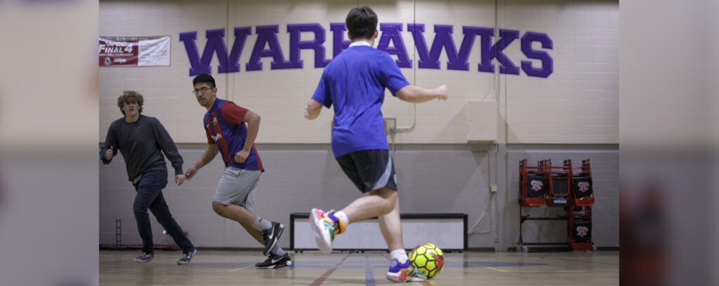 Photo of soccer players scrimmaging in Frank Holt Gymnasium at the UW-Whitewater Rock County campus on April 18, 2024. (UW-Whitewater photo/Craig Schreiner)
