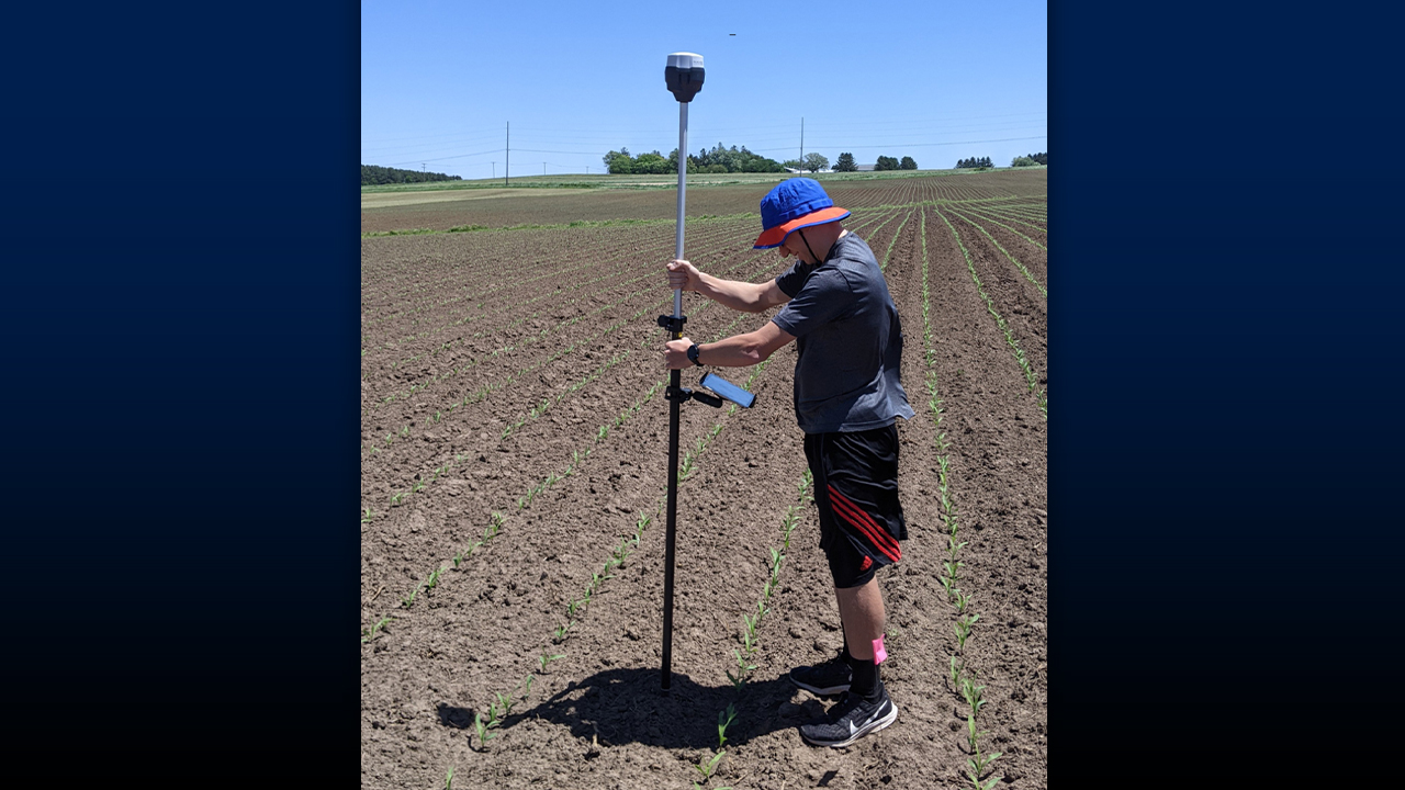 Photo of UW-Platteville researcher demonstrating precision agriculture. “Precision agriculture is all about software and mapping the field,” said Dr. Joseph Sanford, assistant professor of soil and crop science. “We aim to introduce common industry software to give our students familiarity with it, so they’re well-prepared when they start their new jobs.”