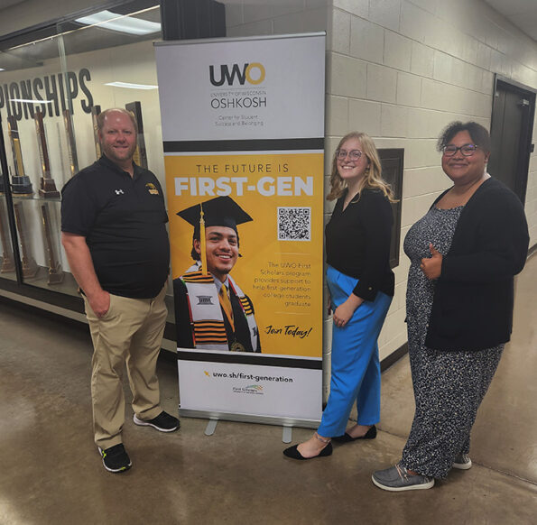 Photo of UWO Academic Adviser Jason Herman, left, taking some time with first-generation students Madelyn Blaser, a junior human services leadership student; and Caprice Swanks, senior sociology major.