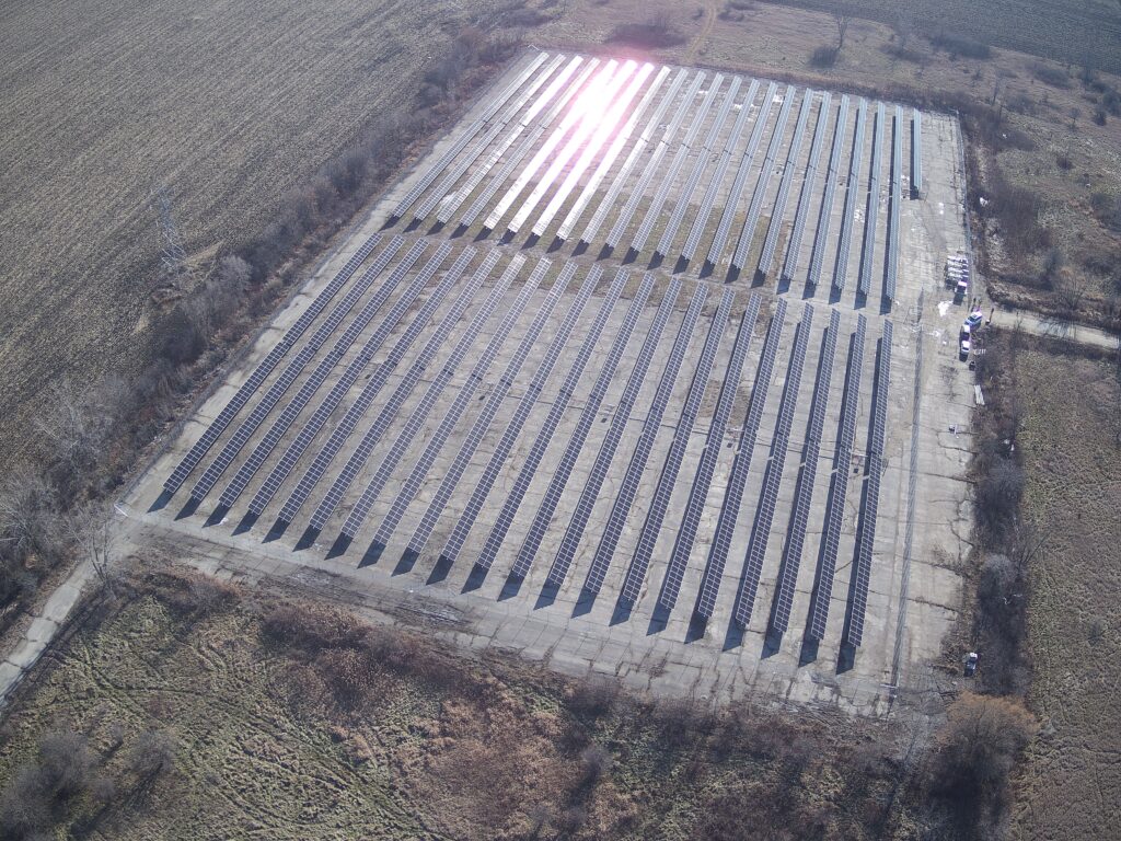 Photo of aerial view of the UW-Parkside Solar Array site. The 2.1-megawatt solar array has reduced campus electrical consumption by approximately 26% since it began operating in December 2023. Built on a former parking lot on the east side of campus, the installation showcases innovative technology through its bifacial panels mounted on tracking arrays that follow the sun's movement throughout the day and capture light reflected from the ground. (Photo credit: Emily Reed)