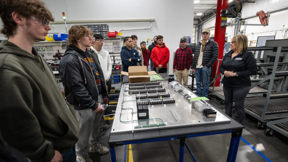 Photo of UWO electrical engineering technology students learning about the Switchgear Power Systems plant in Winneconne.
