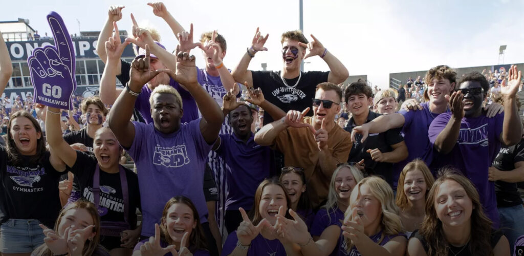 Photo of UW-Whitewater fans dressed in purple
