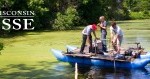 students on a raft in the marsh