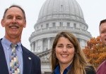 people standing in front of the Capitol building