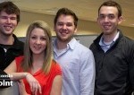 Skyward Grads are seen smiling in their office