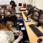 Students use the Oculus Rift in the Game Design and Development computer lab during winter term classes Wednesday, January 14, 2015. Students in the game design and development program will once again travel to L.A. to present their projects to the Jim Henson Company. This time, they are working with the Oculus Rift, a head-mounted virtual reality display.(UW-Stout photo by Brett T. Roseman)