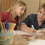 Photos of Karen Stuttgen in the classroom teaching and interacting with students at Fall Creek Elementary School