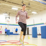 UWL graduate student Elizabeth Skaer helps lead a free fitness program for Summit Elementary School staff. The program is one of many community health and wellness programs led by UWL Physical Therapy students this semester.