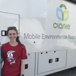 Photo of Melissa Farquhar (left) and Erin McGlynn, UW–Madison professional students, standing outside the Clarke mobile entomology lab, where they are working to identify mosquitoes to assist mosquito-control efforts following Hurricane Harvey. (Photos courtesy Erin McGlynn and Melissa Farquhar)