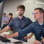 Photo of Matt Kleine (left), who was among the first to begin working at the Sentry IT Co-op with manager Steve Fox. A December graduate of UW-Stevens Point, Matt is now a full-time associate with Sentry Insurance.
