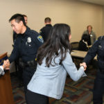 Photo of UW-Eau Claire researchers and Eau Claire police officers after research presentation