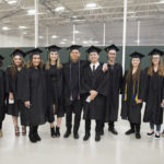 Photo of UW-Parkside graduates gathering for a photo op at the university's December 2018 midyear commencement ceremony.