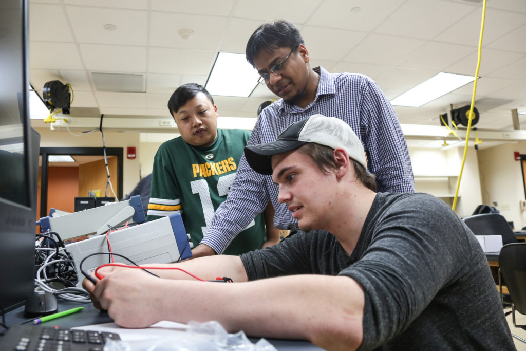 Photo of UW-Green Bay’s Md Maruf Hossain, center