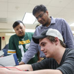 Photo of UW-Green Bay’s Md Maruf Hossain, center