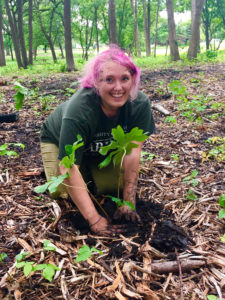 Photo of Chelsea Snowden working with the Root-Pike Watershed Initiative Network to improve soil and water quality.