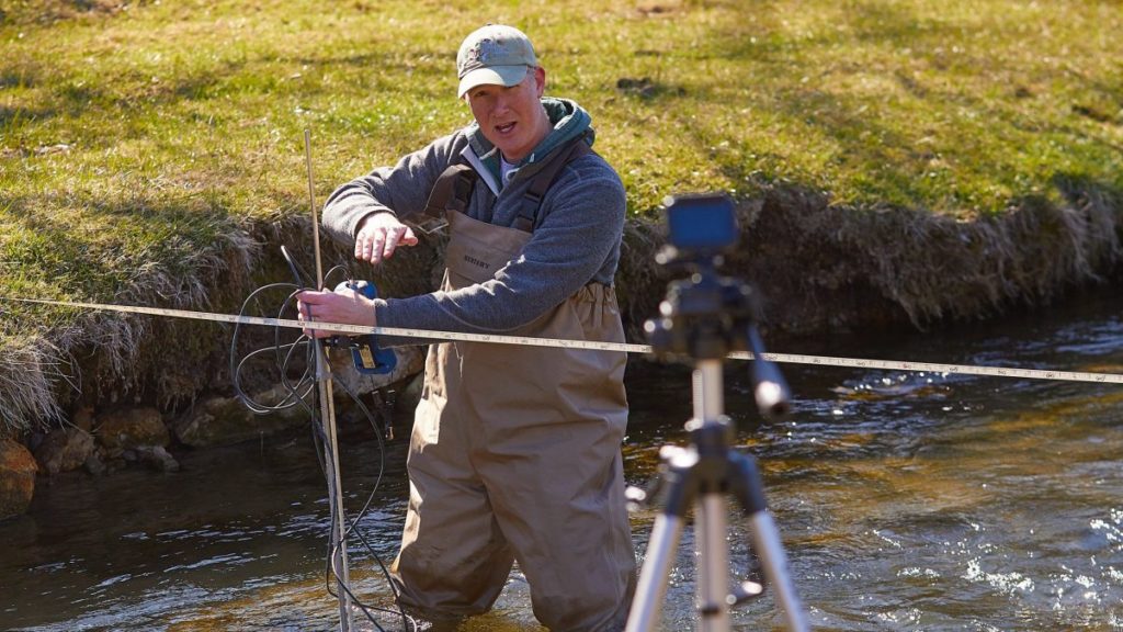 Photo of Colin Belby, associate professor of Geography, taking students on a virtual field trip to Bohemian Valley near Coon Valley, Wisconsin. Belby uses a GoPro to record labs for his Earth Surface Processes and Landforms class.