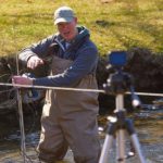 Photo of Colin Belby, associate professor of Geography, taking students on a virtual field trip to Bohemian Valley near Coon Valley, Wisconsin. Belby uses a GoPro to record labs for his Earth Surface Processes and Landforms class.
