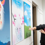 Photo of UW Oshkosh art student displaying work