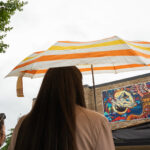 Photo of a large colorful mural—with a unifying theme celebrating differences―on view for all to see this fall on the University of Wisconsin Oshkosh campus.