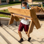 Photo of UW-Platteville student volunteer setting up an outdoor classroom during the COVID-19 pandemic