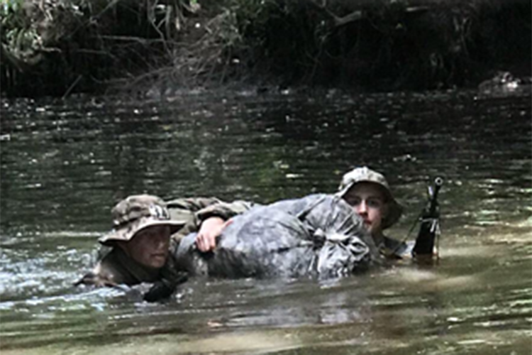 Photo of Douglas Machkovech (left) participating in an Army jungle operations course in Hawaii. (Photo courtesy of Douglas Machkovech)