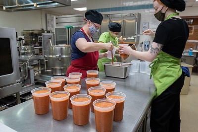 Photo of dietetics students making soup that will be shared with the community through Farmshed's Buy a Quart, Donate a Meal program.