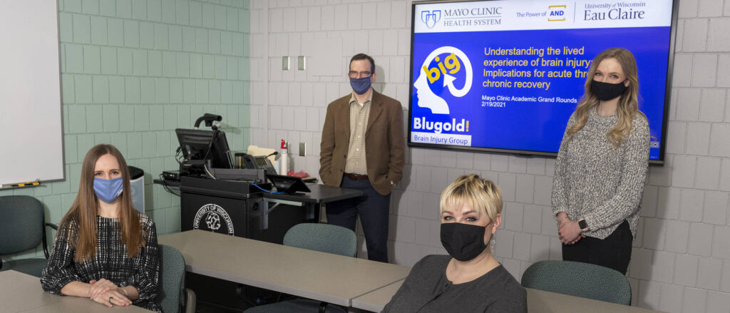 Photo of undergraduate and graduate students in UW-Eau Claire’s communication sciences and disorders programs who assisted Blugold Brain Injury Group members in developing a presentation for Mayo Clinic Health System providers. In the presentation, BBIG members told providers what it’s like to live with a traumatic brain injury. Blugolds helping with the project include (seated from left) Bailey Harder and Crystal Zehm, and (standing from left) Dr. Jerry Hoepner and Hannah Yingst.