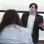 Photo of Dr. Thomas Kemp teaching an economics class this semester that focuses on the economic impact of the COVID-19 pandemic. The class gives students an opportunity to research and analyze topics and data relating to the pandemic even as the crisis continues.